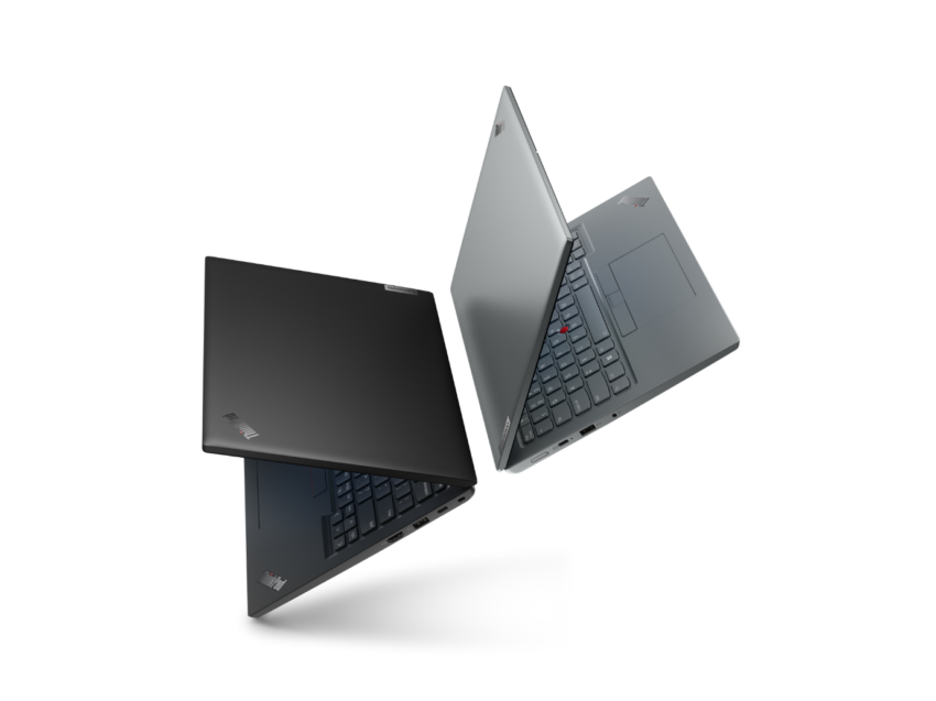 A couple of laptops on a black background Description automatically generated